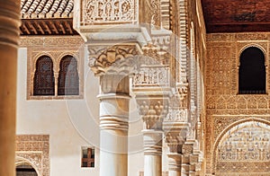 Marble capitals and stucco decoration of the portico in Court of Myrtles in Comares Palace Alhambra, Andalusia, Spain. Magic