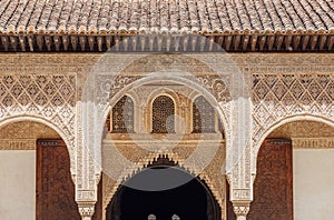 Marble capitals and stucco decoration of the portico in Court of Myrtles in Comares Palace Alhambra, Andalusia, Spain. Magic