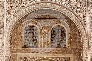 Marble capitals and stucco decoration of the portico in Patio del Cuarto Dorado in Mexuar in Comares Palace Alhambra, Andalusia,