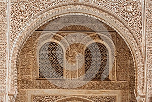 Marble capitals and stucco decoration of the portico in Patio del Cuarto Dorado in Mexuar in Comares Palace Alhambra, Andalusia, photo
