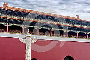 Marble carved columns Huabiao against on the background of the historic building of the Imperial Palace Forbidden City photo