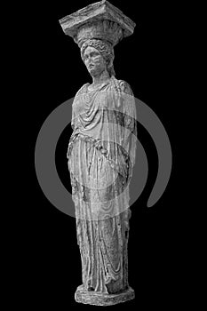 Marble column Caryatid isolated on a black background. Ancient greek stone sculpture