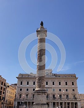 Marble column of Marcus Aurelius with spiral relief on Piazza Colonna, Rome, Italy.