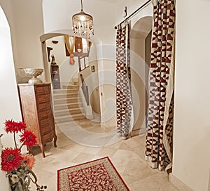 Marble staircase in luxury villa home with wooden bannister photo