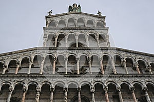 Marble facade of the Basilica church San Michele in Foro from beneath in Lucca, Tuscany, Italy
