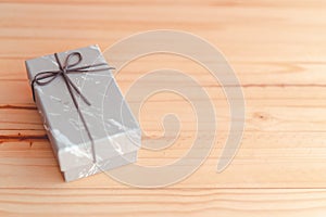 Marble gift box on wooden pallet background