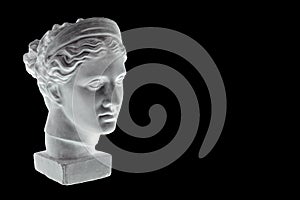 Marble head of young woman, ancient Greek goddess bust isolated on black background