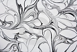 Marble texture formed by mixing white  gray paints, abstract background