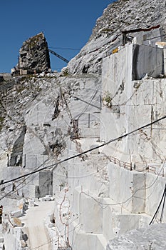 Marble quarry. Large white marble quarry with blue sky background