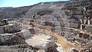 Marble quarry pit full of rocks and blocks of marble in Marmara island, Balikesir, Turkey