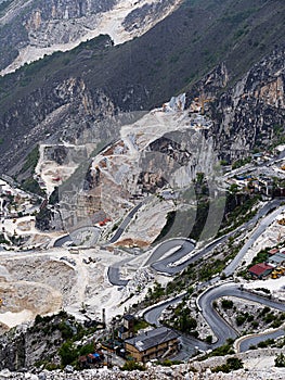 Marble quarry view with hairpin mountain road views, Italy