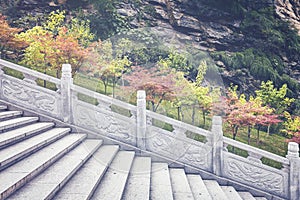 Marble stairs in autumnal park, China.