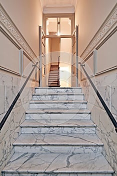 Marble stairs in renovated mansion stairwell