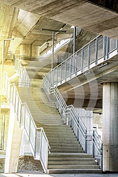 Marble stairs under the bridge with oragne sun