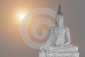 Marble statue of Buddha sitting in meditation