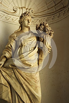 Marble statue - woman with cone of flowers