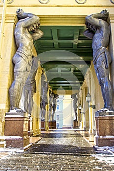 Marble statues of Atlant`s hold ceiling of New Hermitage, St. Petersburg, Russia