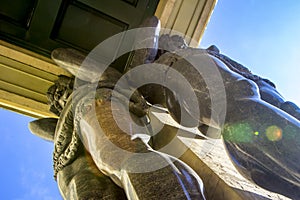 Marble statues of Atlant`s hold ceiling of New Hermitage, St. Petersburg, Russia