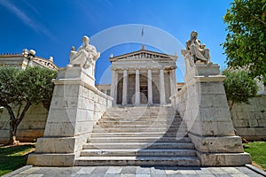 Marble statues of Plato and Socrates, ancient Greek philosophers, in chairs, main entrance to Academy of Athens