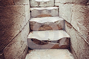 The marble steps are worn from people walking up the spiral staircase inside the leading tower of Pisa.