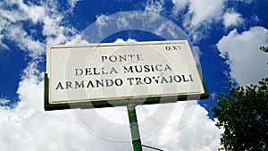 Marble street plaque of the Ponte della Musica-Armando Trovajoli. pedestrian bridge dedicated to the Italian pianist, composer and photo