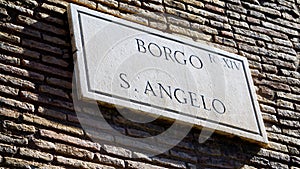 Marble street plate on the wall of the Il Passetto di Borgo, elevated walkway about 800 m long