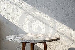 Marble table with white stucco wall and light beam