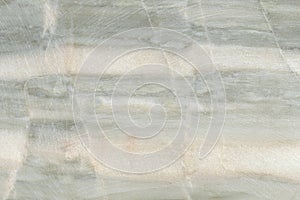 Marble texture with traces of coarse polishing. closeup