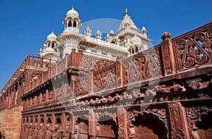 Marble towers of the ancient Indian palace with a patterned wall