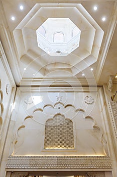 Marble wall and void ceiling decorated with Arabic design at department store in Dubai