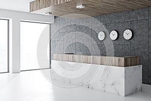 Marble reception in office lobby, clocks photo