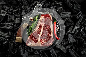 marbled beef T-bone or porterhouse beef meat Steak on BBQ grill coal. Fresh meat for grilling. steak raw striploin of beef. top