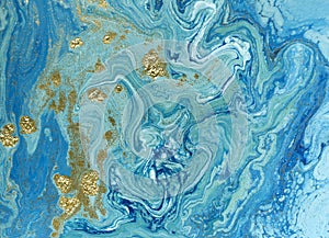 Marbled blue and golden abstract background. Liquid marble pattern