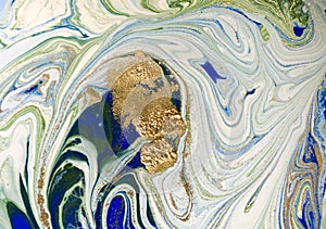 Marbled blue, green and gold abstract background. Liquid marble pattern.