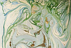 Marbled blue, green and gold abstract background. Liquid marble pattern.