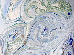Marbled blue, green and gold abstract background. Liquid marble pattern.