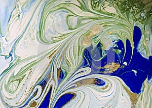 Marbled blue, green and gold abstract background. Liquid marble pattern.