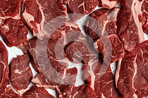 Marbled meat, top blade meat steak, on table background, with copy space for text