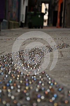 Marbles embedded on pavement photo