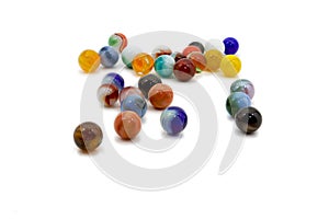 Marbles spread on white