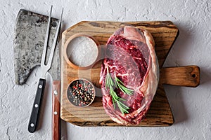 Marbling ribeye steak on wooden board