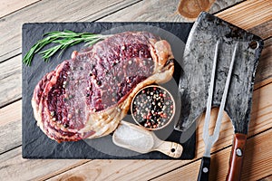 Marbling ribeye steak on wooden board