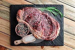 Marbling ribeye steak on wooden board