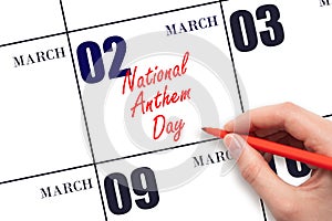 March 2. Hand writing text National Anthem Day on calendar date. Save the date.