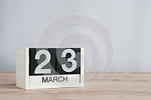 March 23rd. Day 23 of month, wooden calendar on light background. Spring time, empty space for text