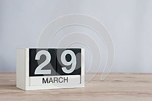 March 29th. Day 29 of month, wooden calendar on light background. Spring time, empty space for text