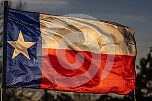 MARCH 6, 2018 - TEXAS STATE FLAG - Texas Lone Star flag stands out against a cloudless blue. Waving, Blue