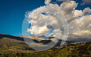 MARCH 7, 2019, MALIBU, LA, CA, USA - Mountainous landscape of Ojai with greenfields and sunset clouds