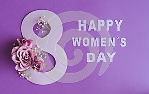 march 8 international women\'s day. violet roses with paper letters