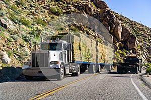 March 18, 2019 Borrego Springs / CA / USA - Truck transporting bailes of hay through the mountains